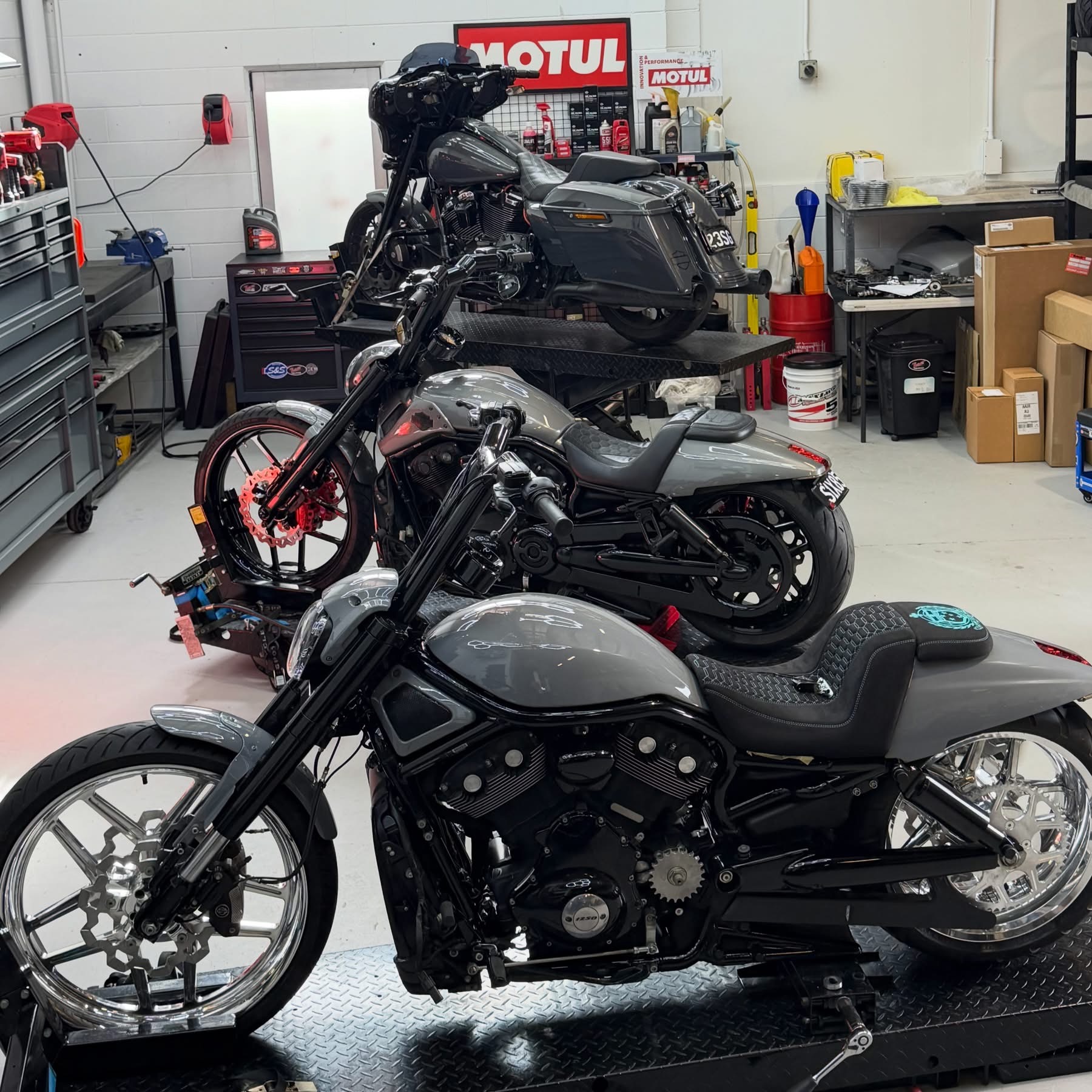 Custom Harley-Davidson builds lined up in the CHASEN Cycles workshop